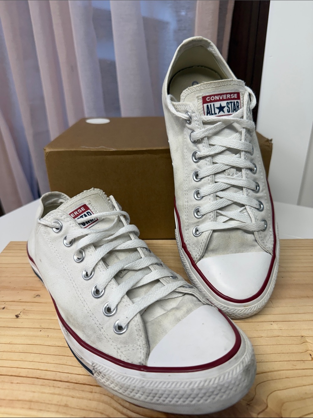 Converse Low Top Sneakers in White with Red Trim